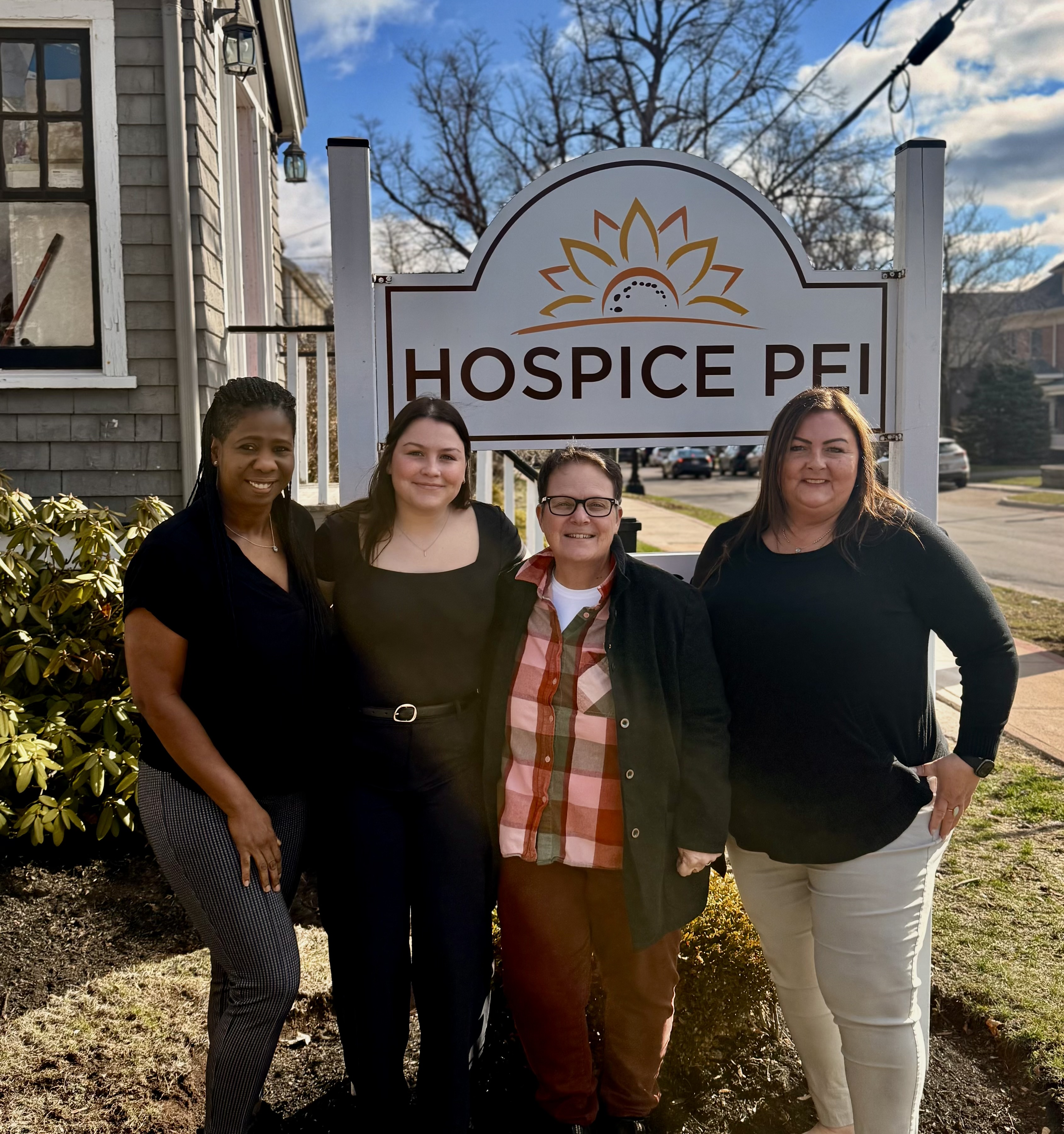 Julia Lea poses with her colleagues outside of Hospice PEI in Charlottetown