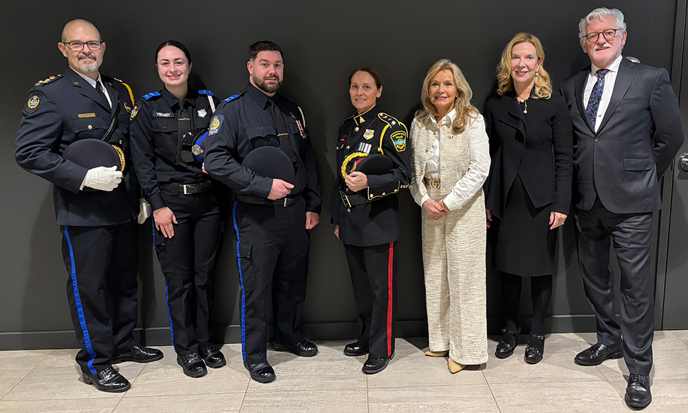 In this photo: Jeffery Minten, Executive Director, Atlantic Police Academy, Graduates Briana Vessey and Michael McNeil, Deputy Chief Mary Henderson, Kennebecasis Regional Police Force,     The Hon. Barb Ramsay, Minister of Social Development and Seniors, Jessie Inman, Chair, Holland College Board of Governors, Dr. Sandy MacDonald, President and CEO, Holland College pictured at the APA Graduation Ceremony.