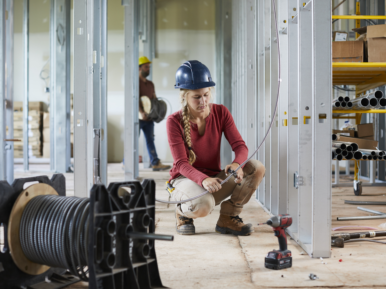 Construction Electrical student at work on site
